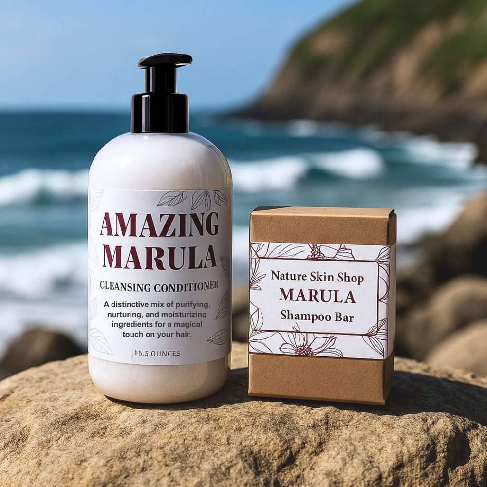 Cleansing conditioner bottle and shampoo bar box on a rock with ocean background