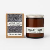 Artisan soy candle labeled 'Middle Earth' from Nature Skin Shop with its packaging on a white background.