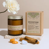 Moonstone artisan soy candle with packaging and natural items on a light background