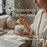 A woman in a beige robe holds an open jar of hair nourishing shampoo with cream visible inside, set on a windowsill in a softly lit room. Large overlaid text reads, 'THE FOUNDATION OF STRONG HAIR' and 'Rebuild your hair’s lipid barrier with a small-batch ritual for resilient, smooth ends.