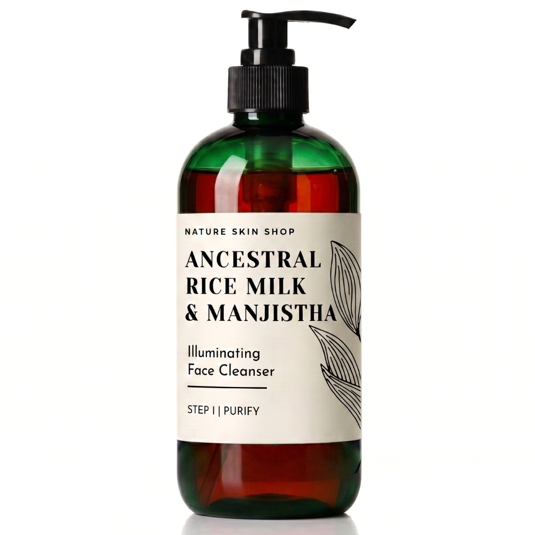 A bottle of Nature Skin Shop Ancestral Rice Milk & Manjistha Illuminating Face Cleanser, Step I | Purify. The product is in a dark amber green translucent bottle with a black pump dispenser and a cream-colored label featuring black text and botanical line art.