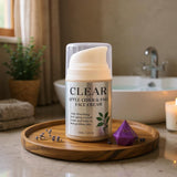 Clear Apple Cider & Sake Face Cream on a wooden tray in a bathroom setting