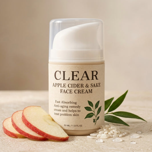 Clear Apple Cider & Sake Face Cream with apple slices and seeds on a neutral background