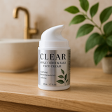 Clear Apple Cider & Sake Face Cream jar on a wooden surface with a bathroom background