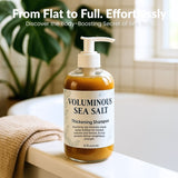 Bottle of voluminous sea salt thickening shampoo on a surface with a plant in the background
