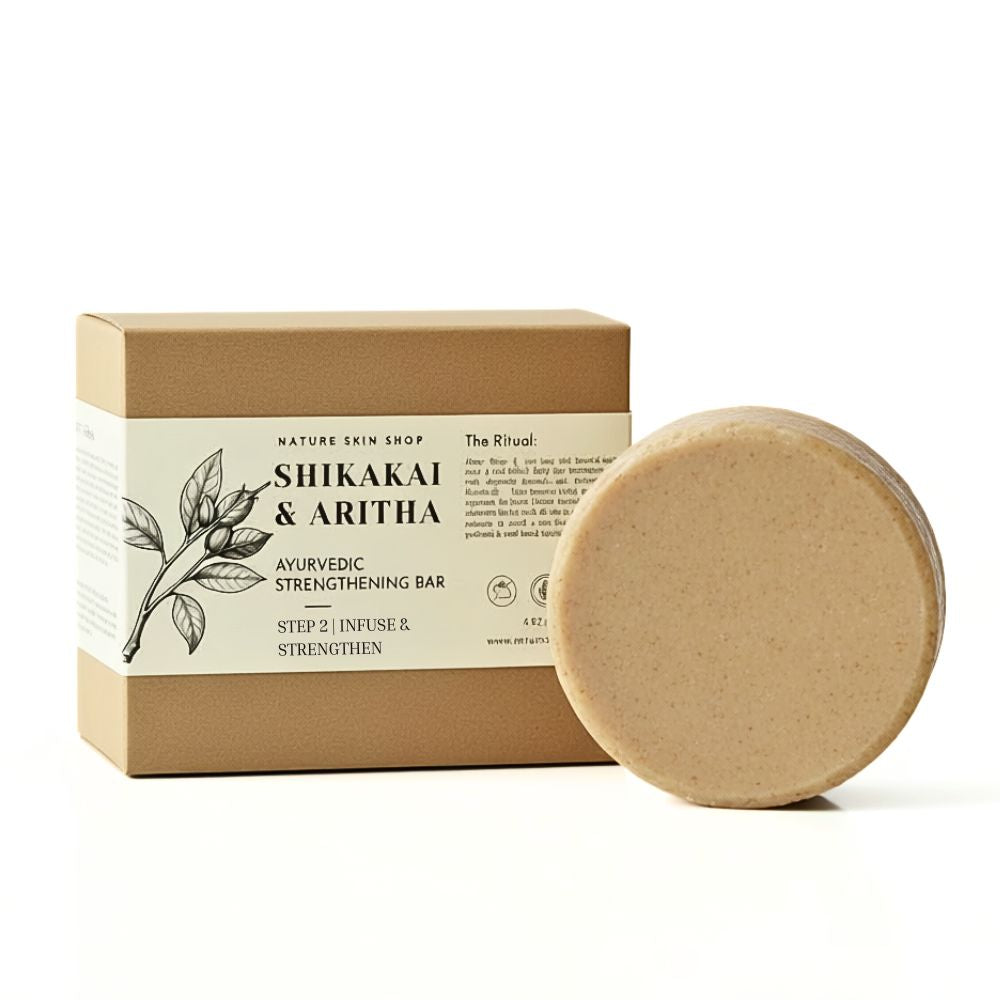 Shikakai and Aritha Ayurvedic strengthening bar with packaging on a white background