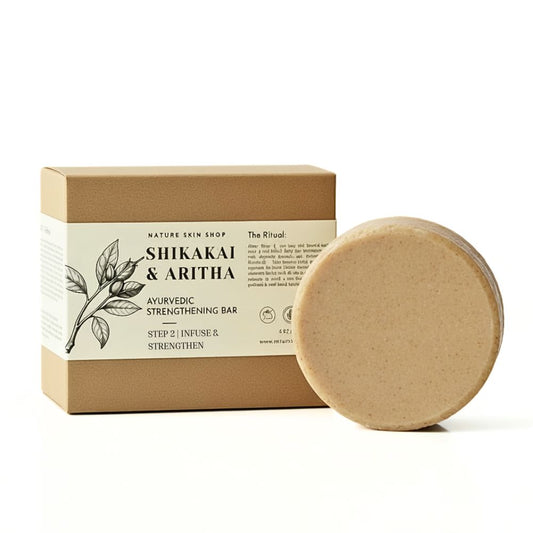 Shikakai and Aritha Ayurvedic strengthening bar with packaging on a white background
