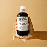 Close-up of Shikakai & Aritha Shampoo label showing plant-based ingredients