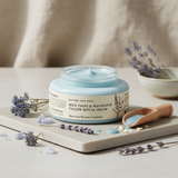Jar of Blue Tansy & Magnesium Tallow Ritual Cream with a wooden scoop on a neutral background