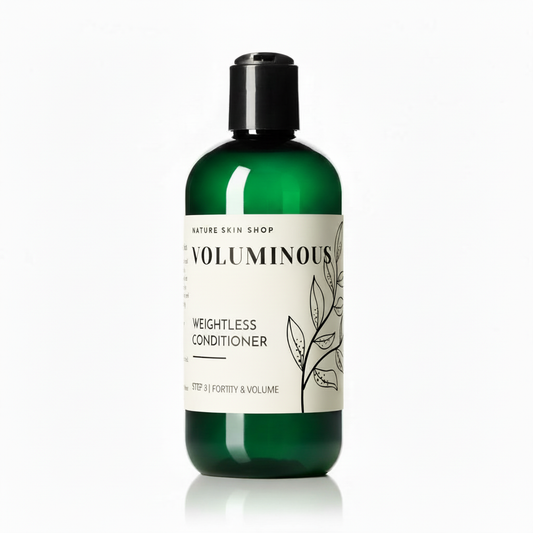 Green bottle of 'Voluminous' weightless conditioner on a white background