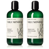 Two dark green bottles of Nature Skin Shop Voluminous hair care products on a white background: Sea Salt Shampoo and Weightless Conditioner, both with black caps and cream labels.