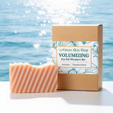 Volumizing Sea Salt Shampoo Bar from Nature Skin Shop with packaging against a sparkling water background
