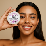 Woman holding a Zoe Keratin Shampoo Bar with a beige background
